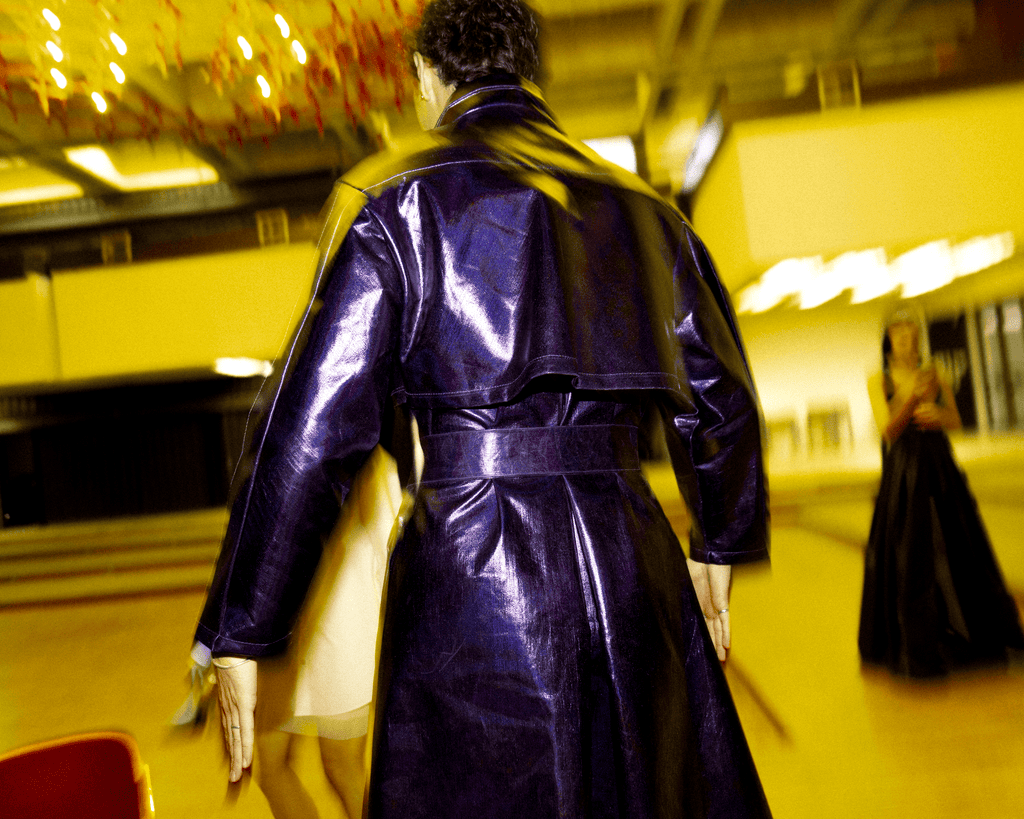 Iridescent violet coated denim mid length coat